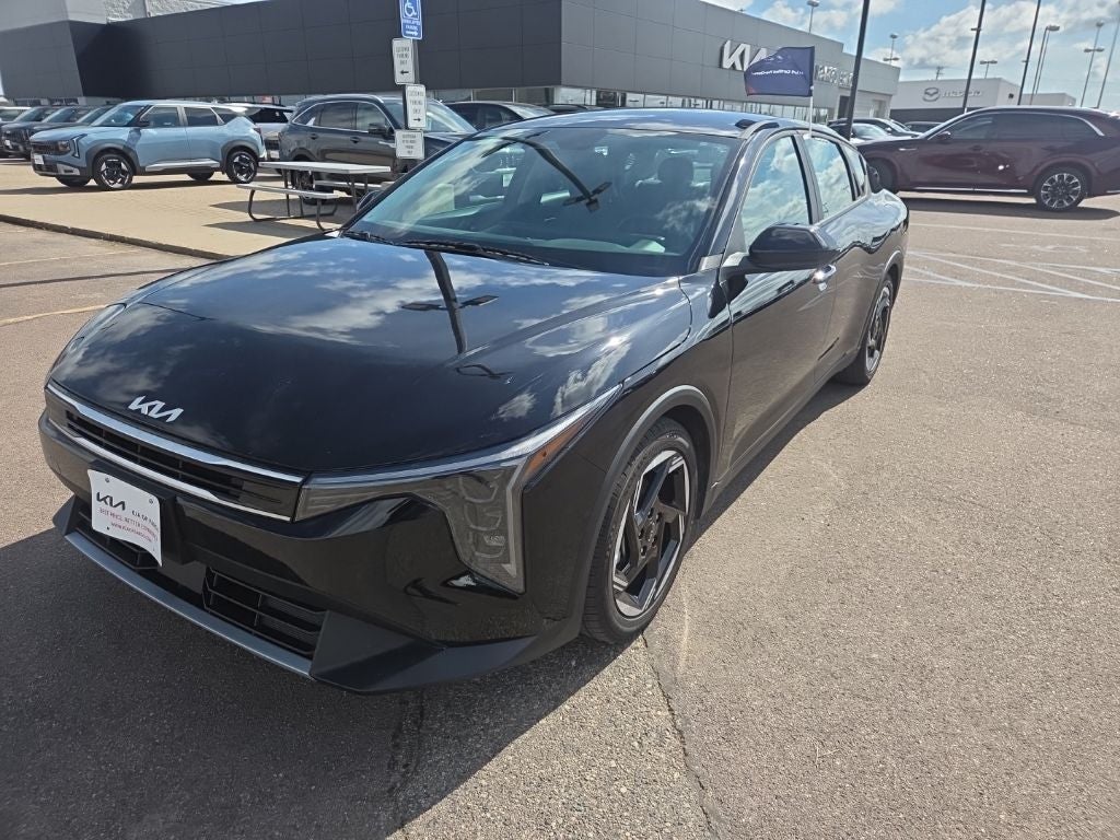 2025 Kia K4 EX in Aurora Black Pearl — front three-quarter view