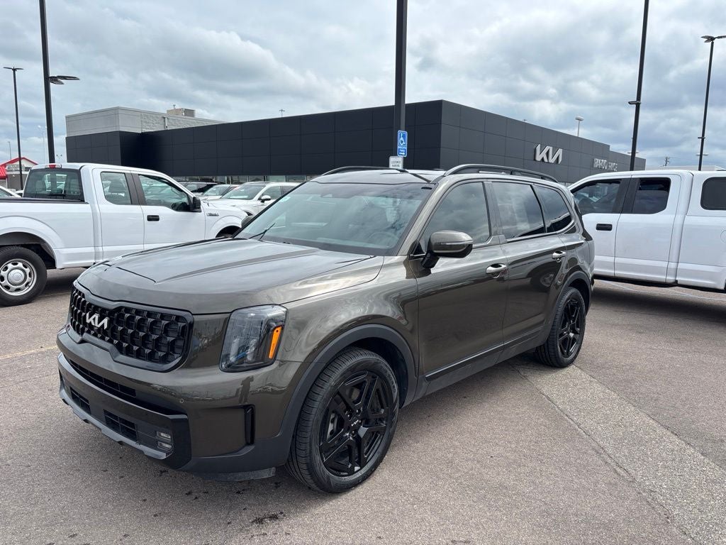 2024 Kia Telluride SX X-Line in Dark Moss — front three-quarter view