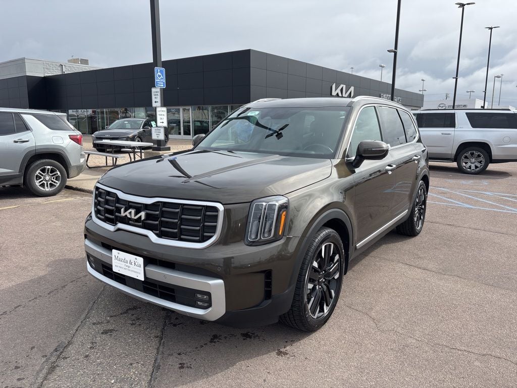 2024 Kia Telluride SX in Dark Moss — front three-quarter view